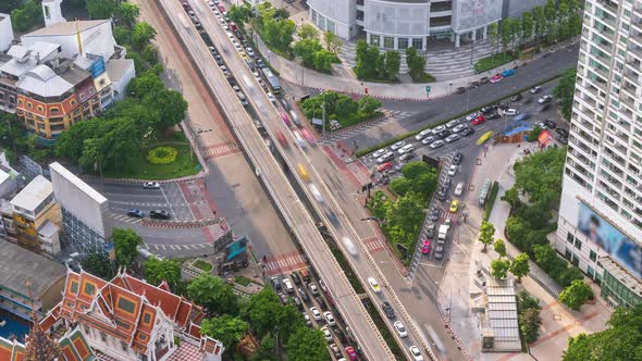 Bangkok business district city center above intersection and traffic - Time Lapse