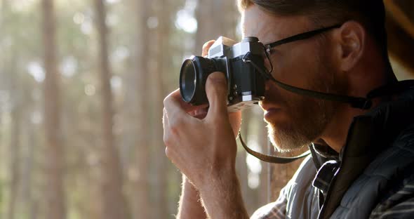 Man Taking Photo with Vintage Camera 4k alt