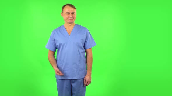 Medical Man Shrugs and Shakes Her Head Negatively, Green Screen alt