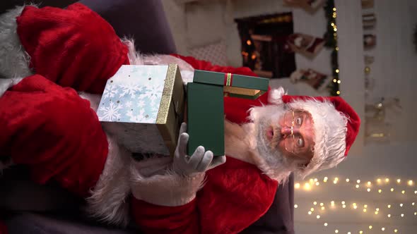 Funny Santa Claus Gift Boxes With Christmas Presents. Choosing New Year Gifts. Santa Delivery