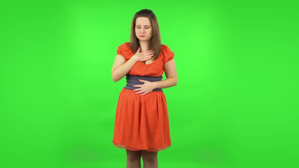 Cute Girl Goting a Cold and Sneezing. Green Screen alt