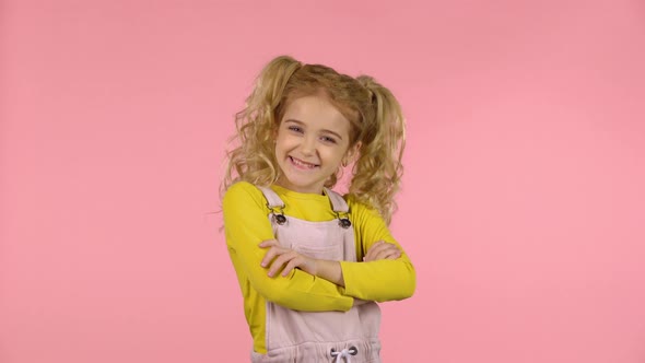 Pretty Young Female Is Pointing To Something with Her Fingers alt