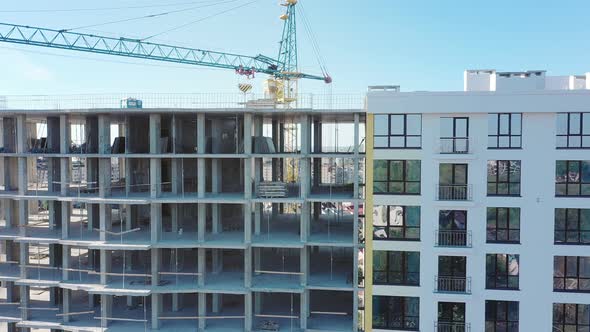 Many windows on new apartment building facade under construction. Real estate development alt