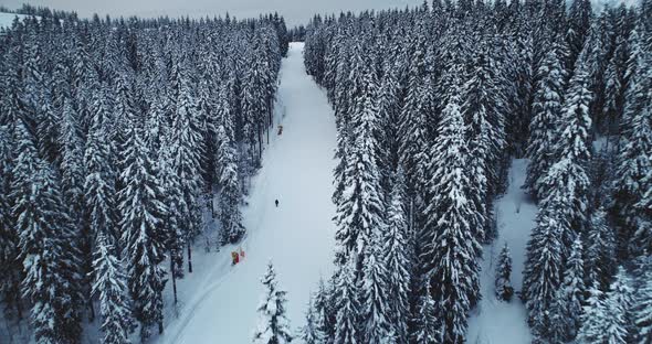 People Skiing on a Ski Resort in the Alps Mountains