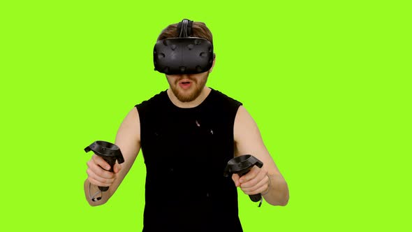 Man Wearing Virtual Reality Headset And Gaming 