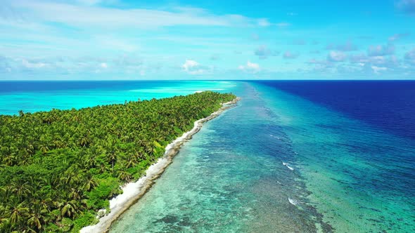 Wide aerial island view of a white sandy paradise beach and aqua blue ocean background in best quali alt