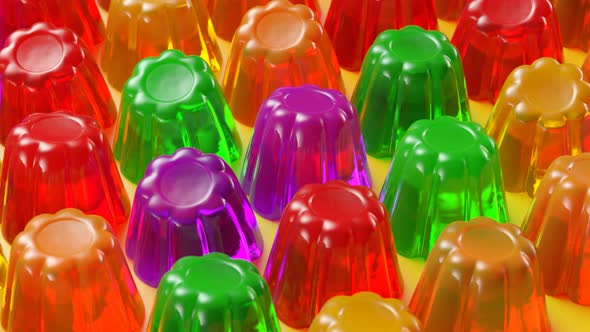 Seamless animation of multiple colorful jellies shaking. Tasty Jello desserts. alt