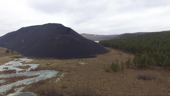 Aerial View of Huge Metallurgical Black Slag Dumps alt