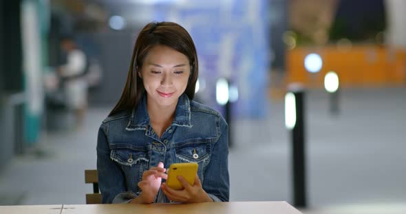Woman use of mobile phone at night  alt