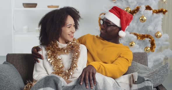 Afro American Woman Wife Girlfriend Curly Girl and Black Man Boyfriend Husband Sitting Together on alt
