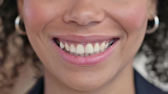 Close Up of Smiling Lips of African Woman alt