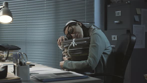 Tired office worker sleeping at work