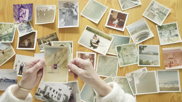 Woman Looking at An Old Photos