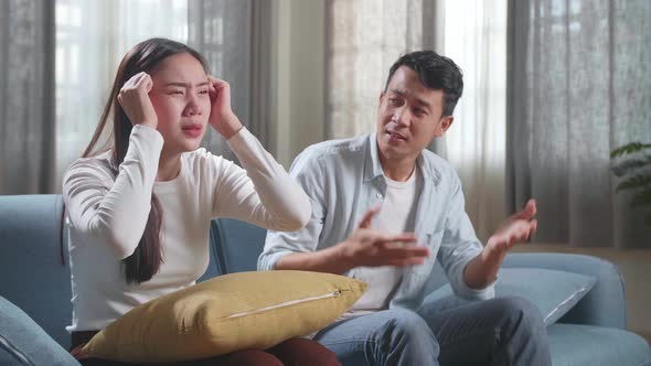 Upset Young Asian Couple Is Frustrated About The Loss Of The Team In Game They Are Watching Tv alt