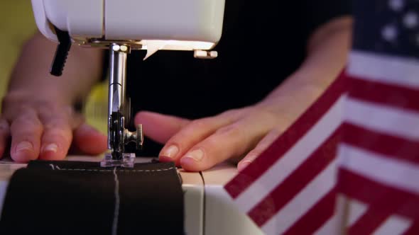 Tailor Sewing And Showing USA Flag In The Side 29