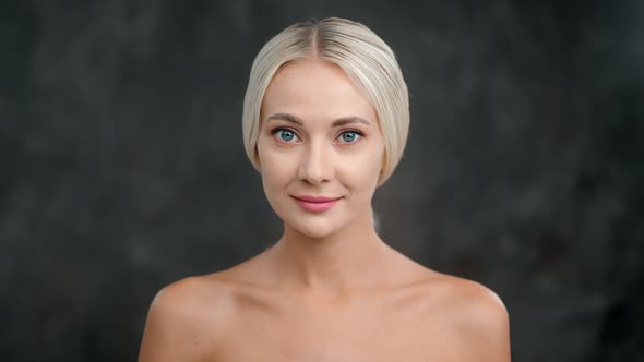 Beautiful Naked Female Model Smiling Posing Isolated at Black Studio Background Medium Closeup alt