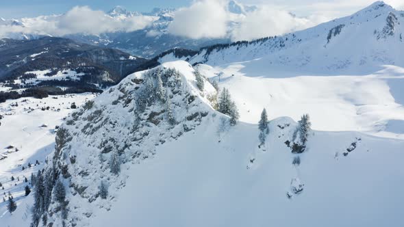 Aerial view of mountains with snow in Onnion, France. alt