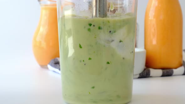 Woman Cooking Healthy Smoothie Add Green Apple Kiwi Spinach Blended in Blender Green Smoothies alt