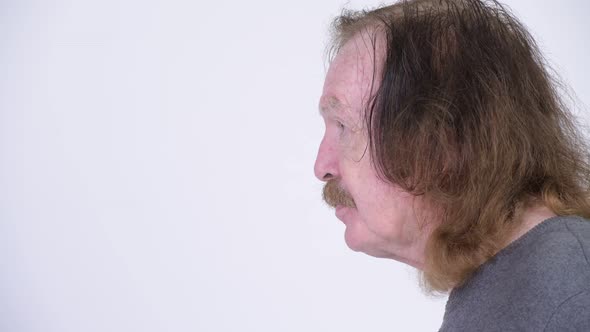 Head Shot Profile View of Senior Man with Mustache alt