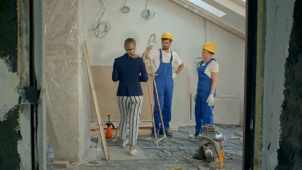 Construction Site Team or Architect and Builder or Worker with Helmets Controlling or Having alt