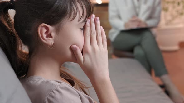 Woman consoling adolescent.  alt
