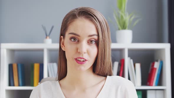 Young Woman Works at Home Office Using Computer. alt