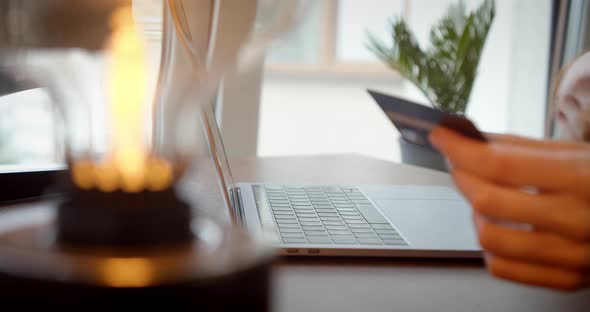 Female Hands Holding Credit Card Making Bank Online Payment or Web Store Using Laptop Technology alt
