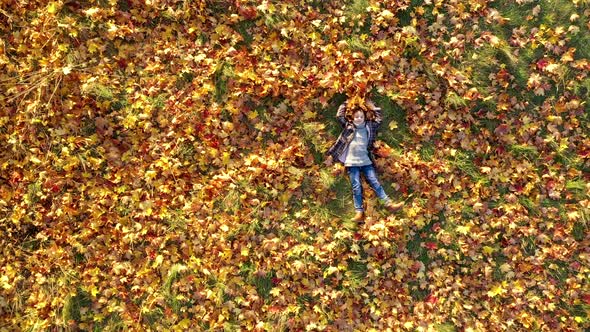 Happy Child in a Beautiful Autumn Park.