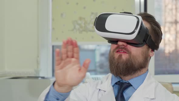 Male Doctor Using 3d Virtual Reality Glasses at the Hospital alt