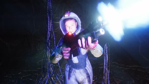 An Astronaut With A Blaster Sneaks Through A Cave