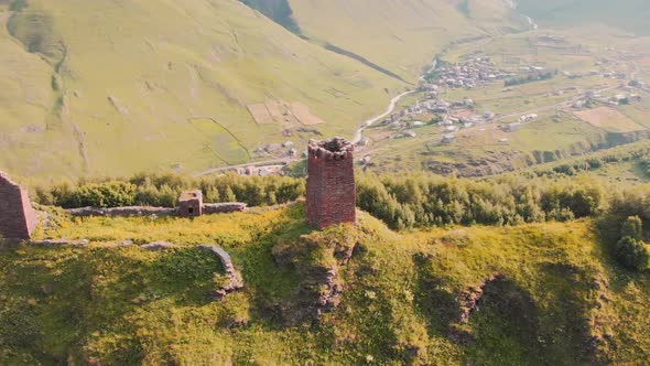 Aerial View Of Tower Ruins With Ushguli Village Background alt