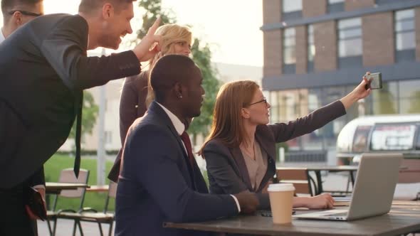 Business Team Taking Selfie Outdoors alt