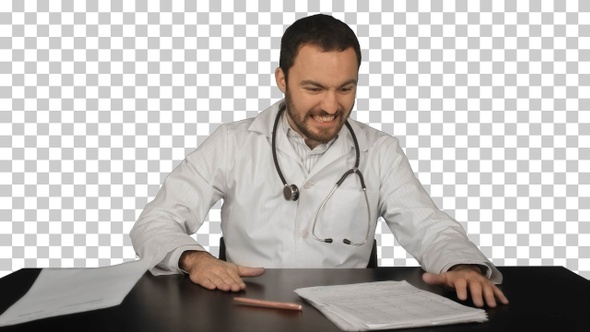 Angry doctor posing at table, Alpha Channel