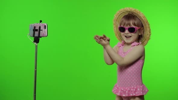 Girl Child Makes Selfie Vlog, Blogging, Video Call on Mobile Phone. Vacation Sea alt