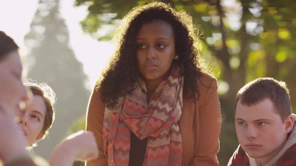 Group of college students on campus meeting outdoors