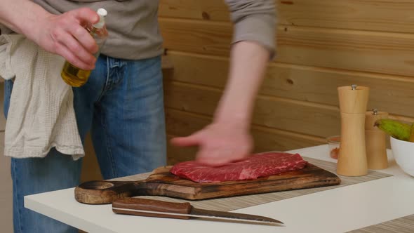 Seasoning Beef Steak With Salt And Pepper