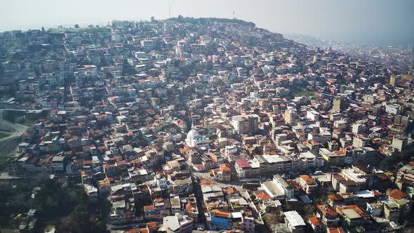 Drone view on poverty slum district and muslim mosque