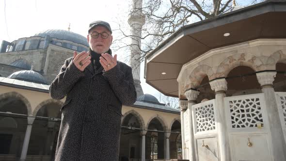 Man In Front Of Ottoman Mosque alt