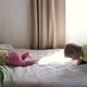 Two Happy Cheerful Little Children Brother and Sister Play Have Fun Jump on Bed - VideoHive Item for Sale