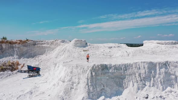 Sporty man in white canyon alt