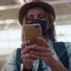 A Young Woman in a Face Protective Mask Using Her Smartphone - VideoHive Item for Sale