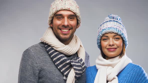 Happy Couple in Winter Clothes Waving Hands 5 alt