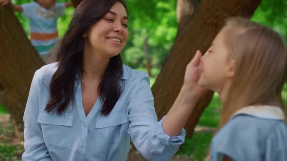 Smiling Mother Caress Daughter on Picnic Close Up alt
