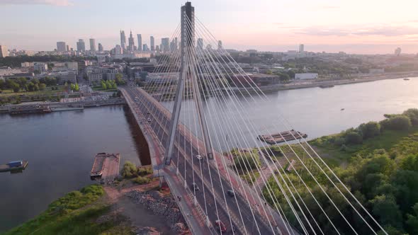Aerial View of the Warsaw Cable Bridge in the Sunset with City on the Background