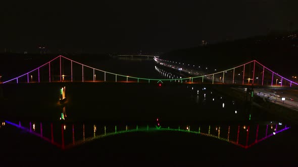 The Pedestrian Park Bridge over the Dnipro River in Kyiv City at Night alt