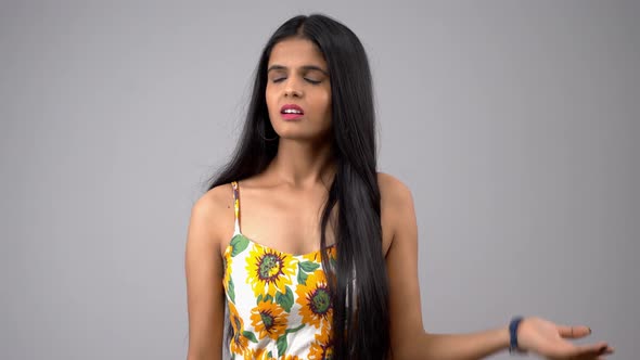 Annoyed Indian girl asking questions alt