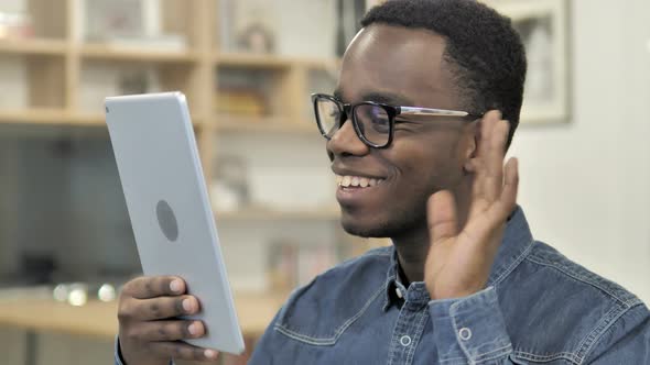 Online Video Chat on Tablet by Afro-American Man alt
