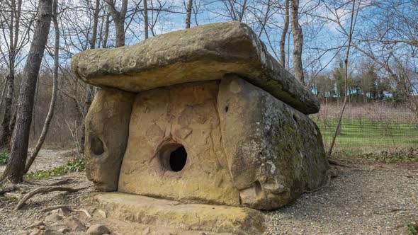 Ancient Caucasus Dolmen in the front of a forest