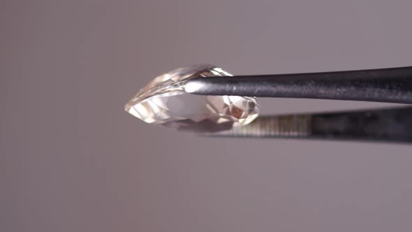 Imperial Champagne Yellow Topaz Pear Cut in the Turning Tweezers
