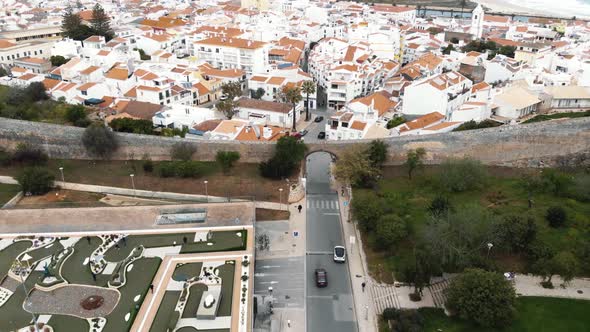 Medieval fortified walls and gate of Lagos city and stunning beach. Algarve, Portugal alt